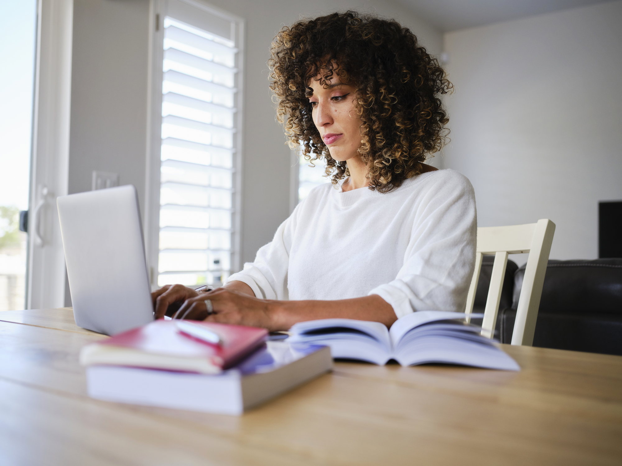 Online student working on a laptop