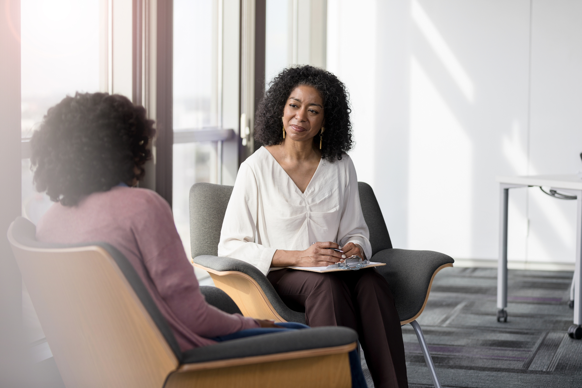 Psychologist talking to patient